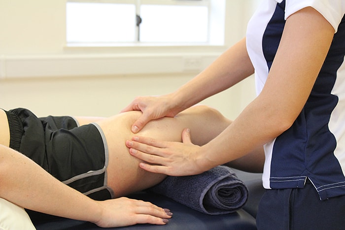 Delayed onset muscle soreness treatment on upper thigh in manchester clinic