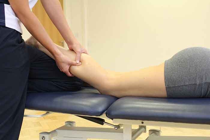 Massage to help improve recovery on lower leg in Manchester clinic