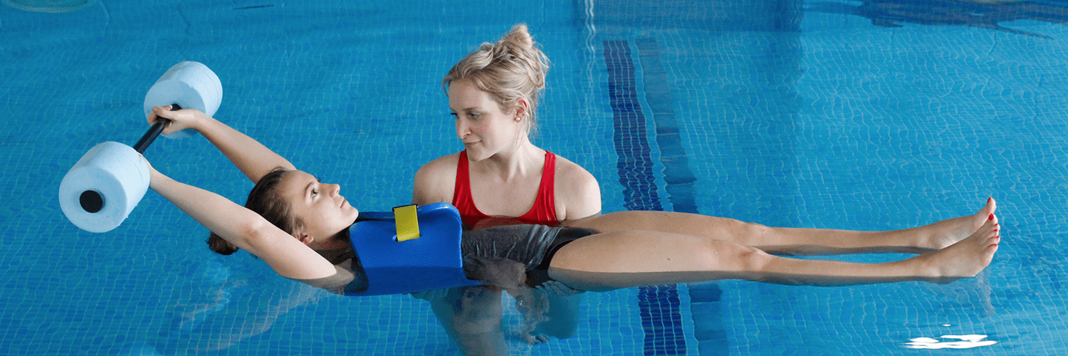 Female uses water aids to help recover in Hydrotherapy session.