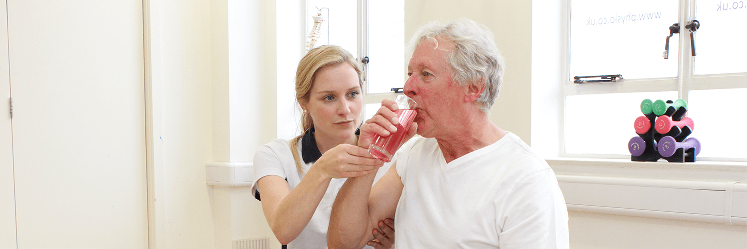 Elderly male recieves Neurological Physiotherapy treatment from experienced Manchester Physiotherapist.