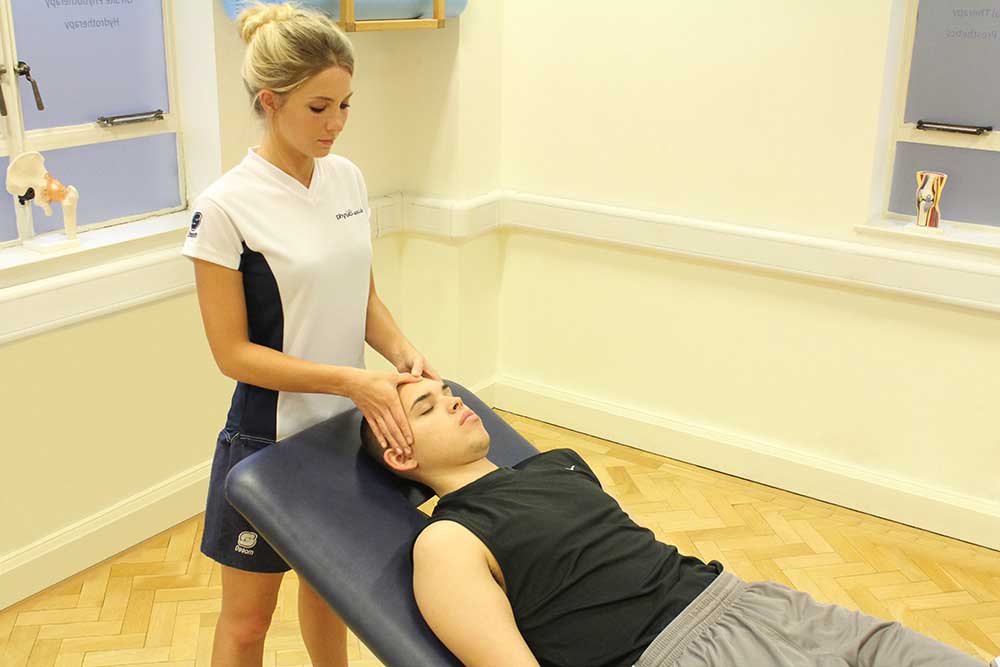 Accupressure massage technique applied to head