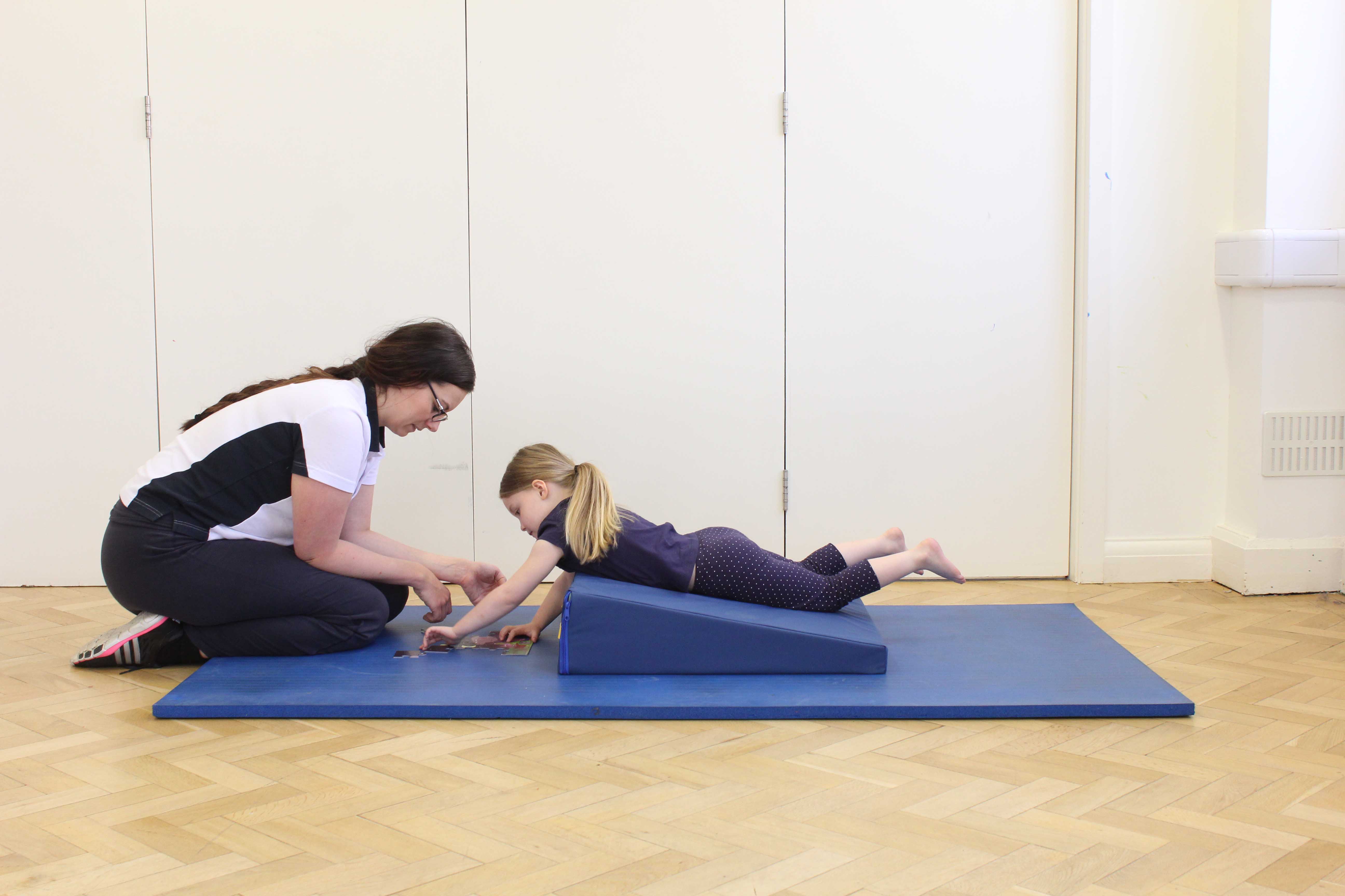 improving posture and raising muscle tone through play activity with a paediatric physiotherapist