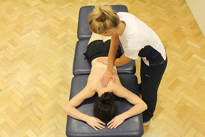 Myofascial release technique on customers back in Manchester clinic Myofascial release technique on customers back in Manchester clinic