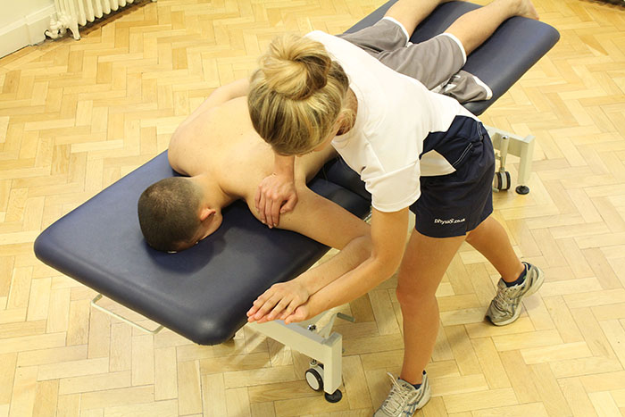 Post injury recovery massage treatment on shoulder in manchester clinic
