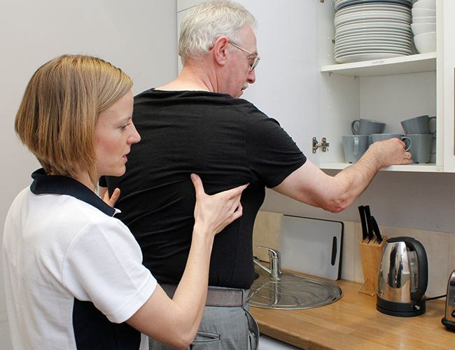 Elderly patient recieves care in everyday home environment.