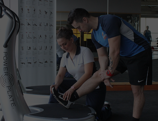 Physiotherapy session undertaken in a gym setting.