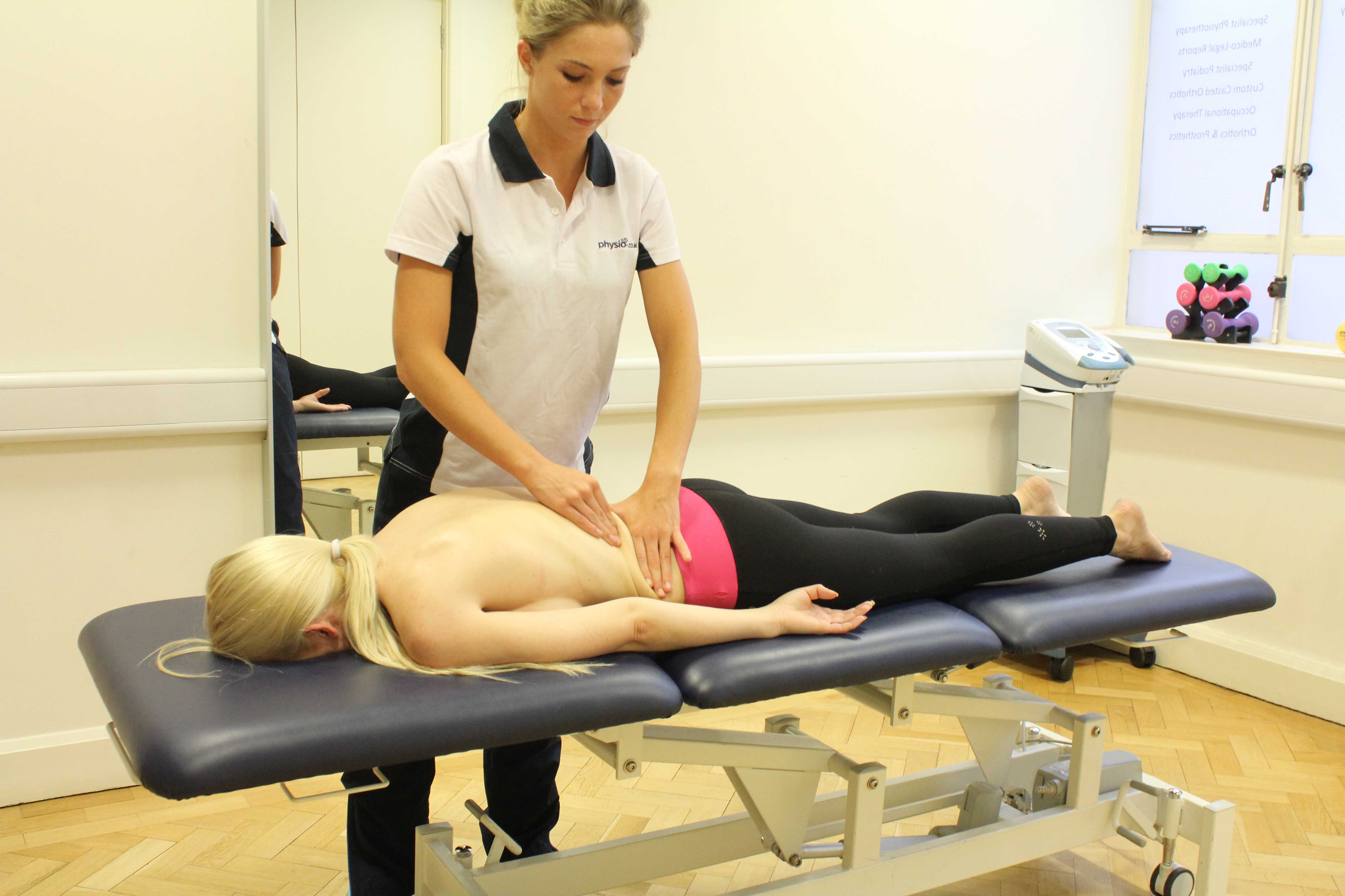 Rolling Soft Tissue Massage applied to the lower back by experienced therapist