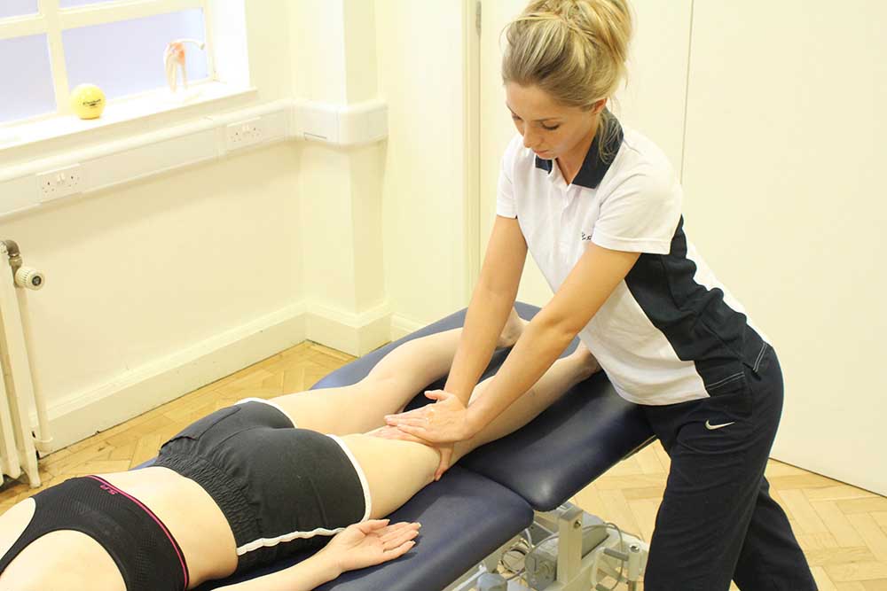 Deep tissue massage of bicep femoris as part of sports training programme