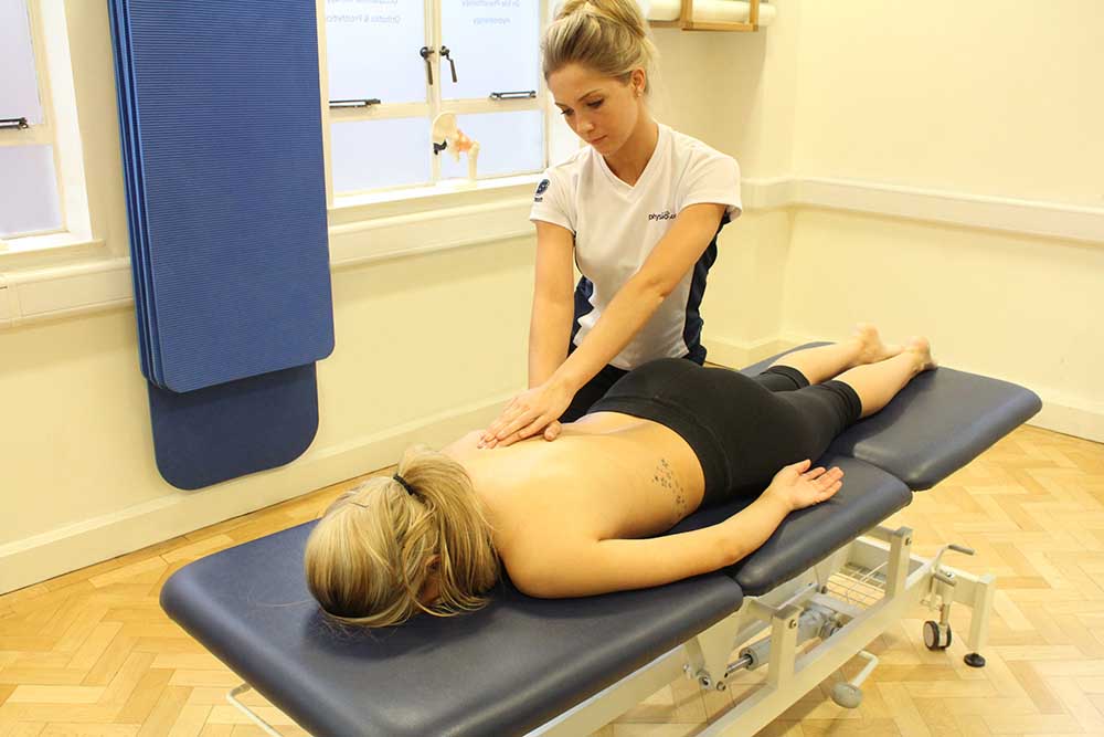 Soft Tissue Massage targeting rhomboids and trapezius back muscles