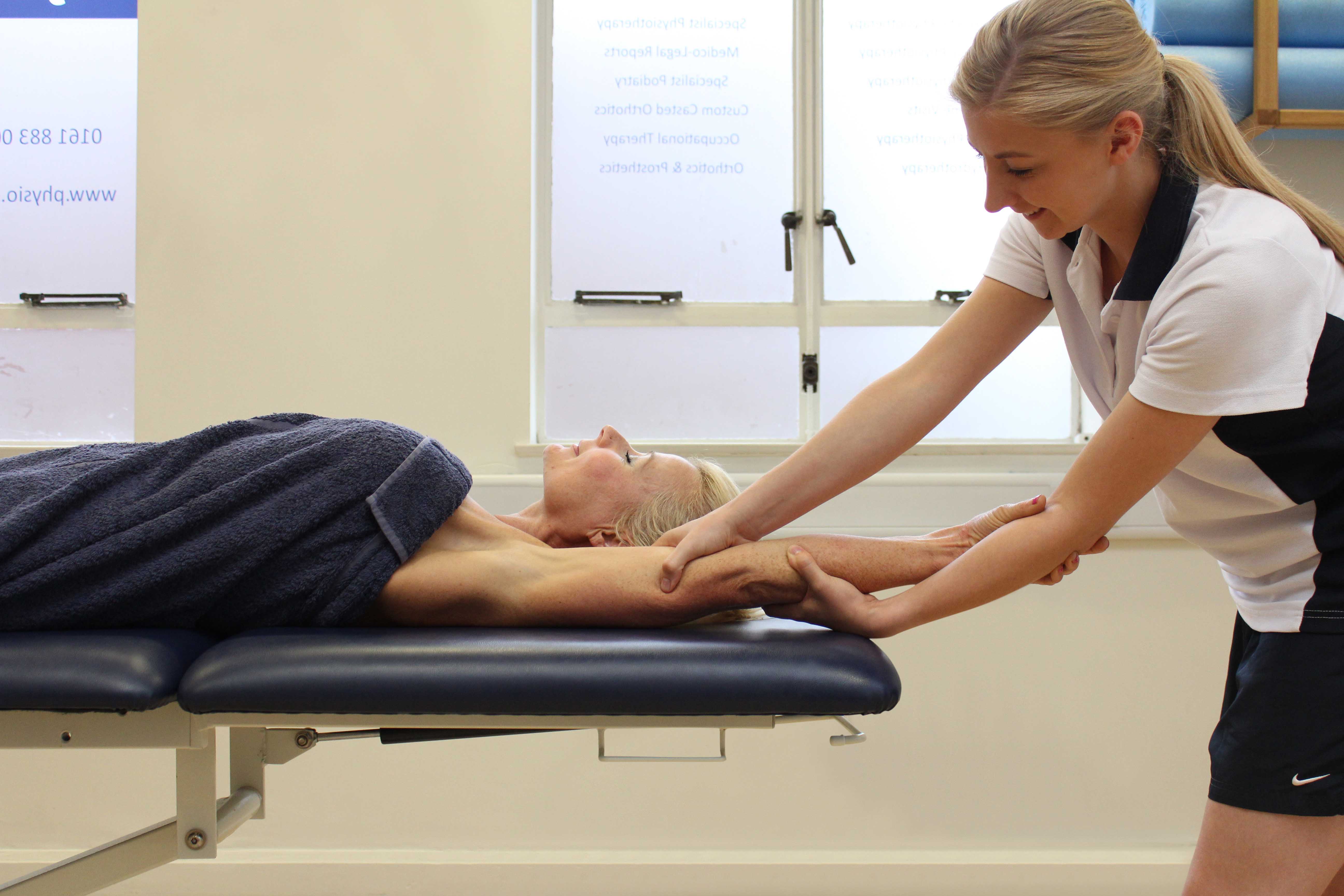Upper arm passive stretch and lymphatic drainage exercises applied by therapist Upper arm passive stretch and lymphatic drainage exercises applied by therapist
