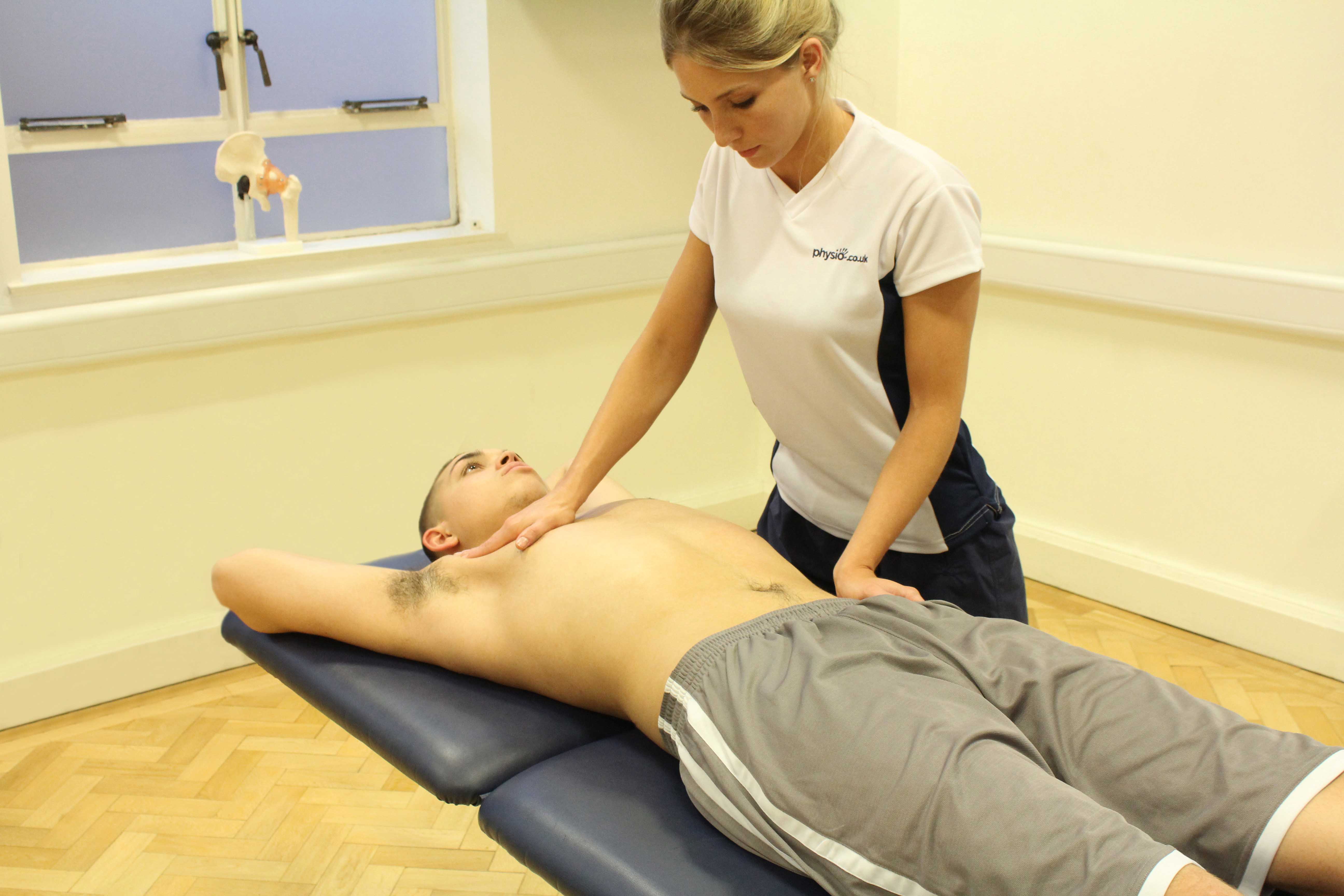 Passive stretch applied to chest muscels by experienced therapist