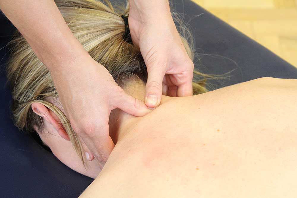 Massage of cervical spine and trapezius muscles to reduce chonic pain symptoms