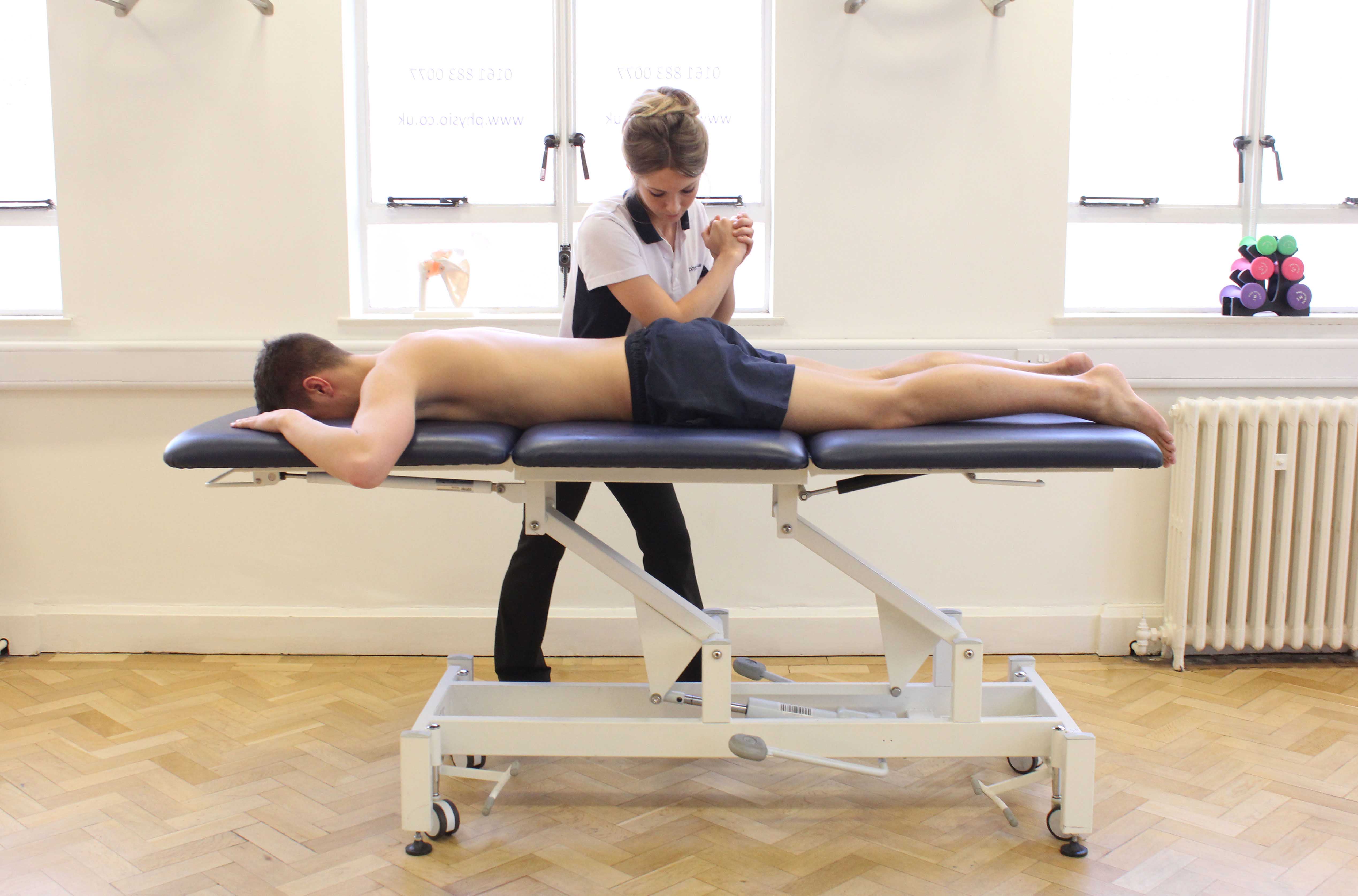 Deep tissue massage of the gluteus maximus muscle by specialist therapist Deep tissue massage of the gluteus maximus muscle by specialist therapist