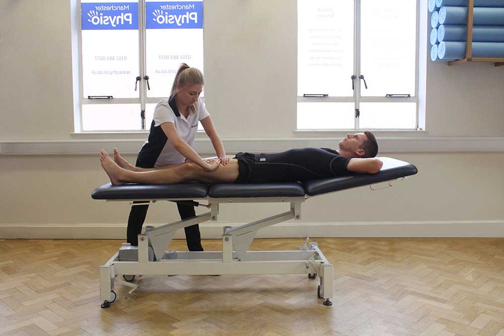 Soft Tissue Massage targeting quadriceps muscle group
