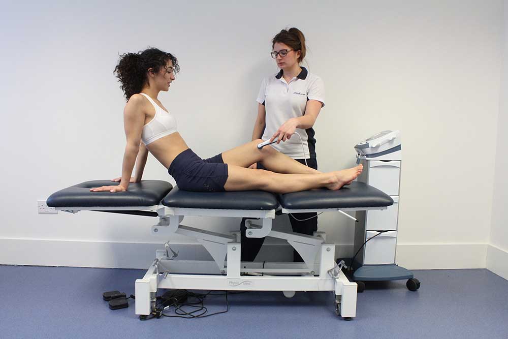 Soft tissue massage of the upper back and trapezius muscles by an experienced physiotherapist