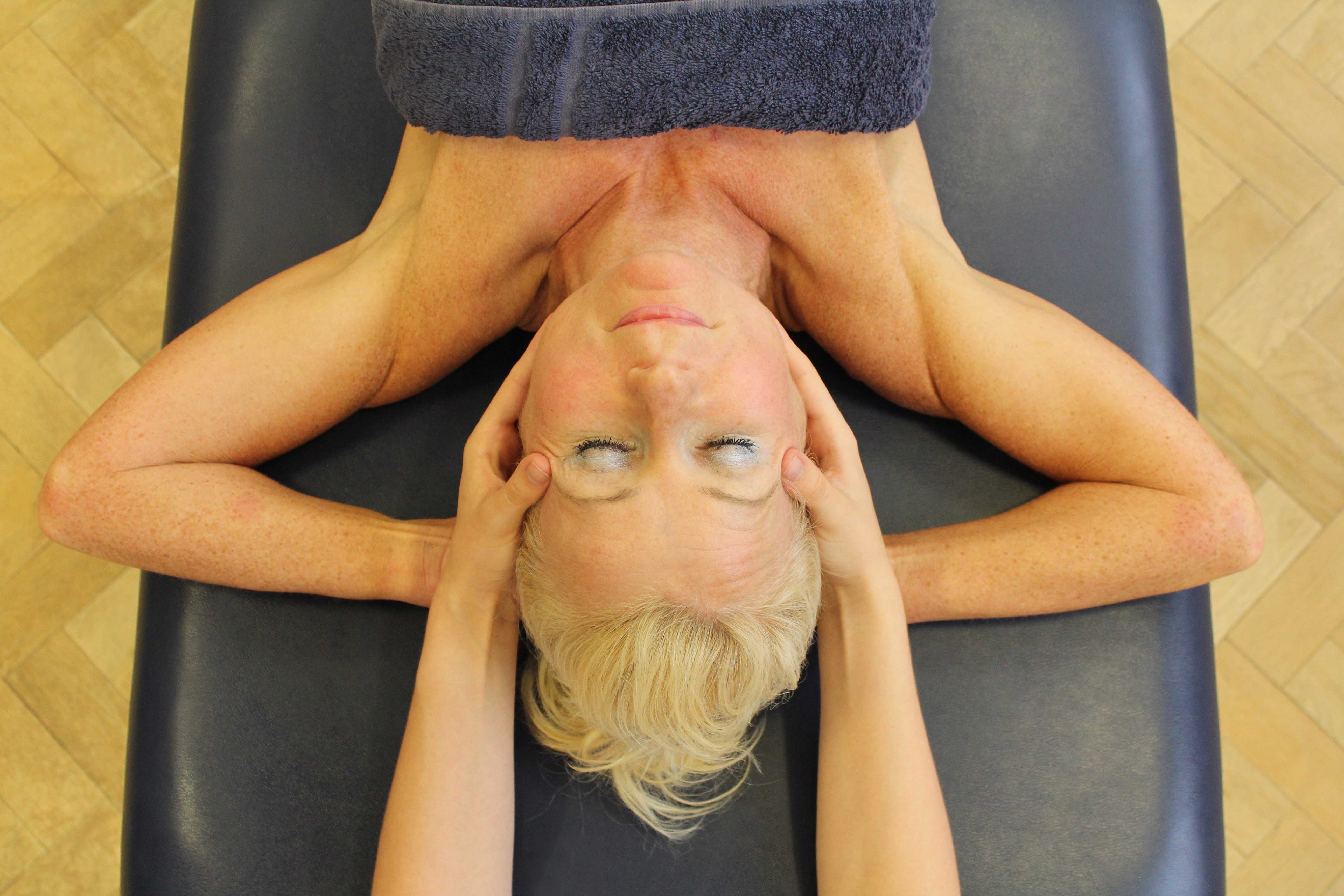Soft tissue massage of head and face to releive stiffness and stimulate neurological repair Soft tissue massage of head and face to releive stiffness and stimulate neurological repair