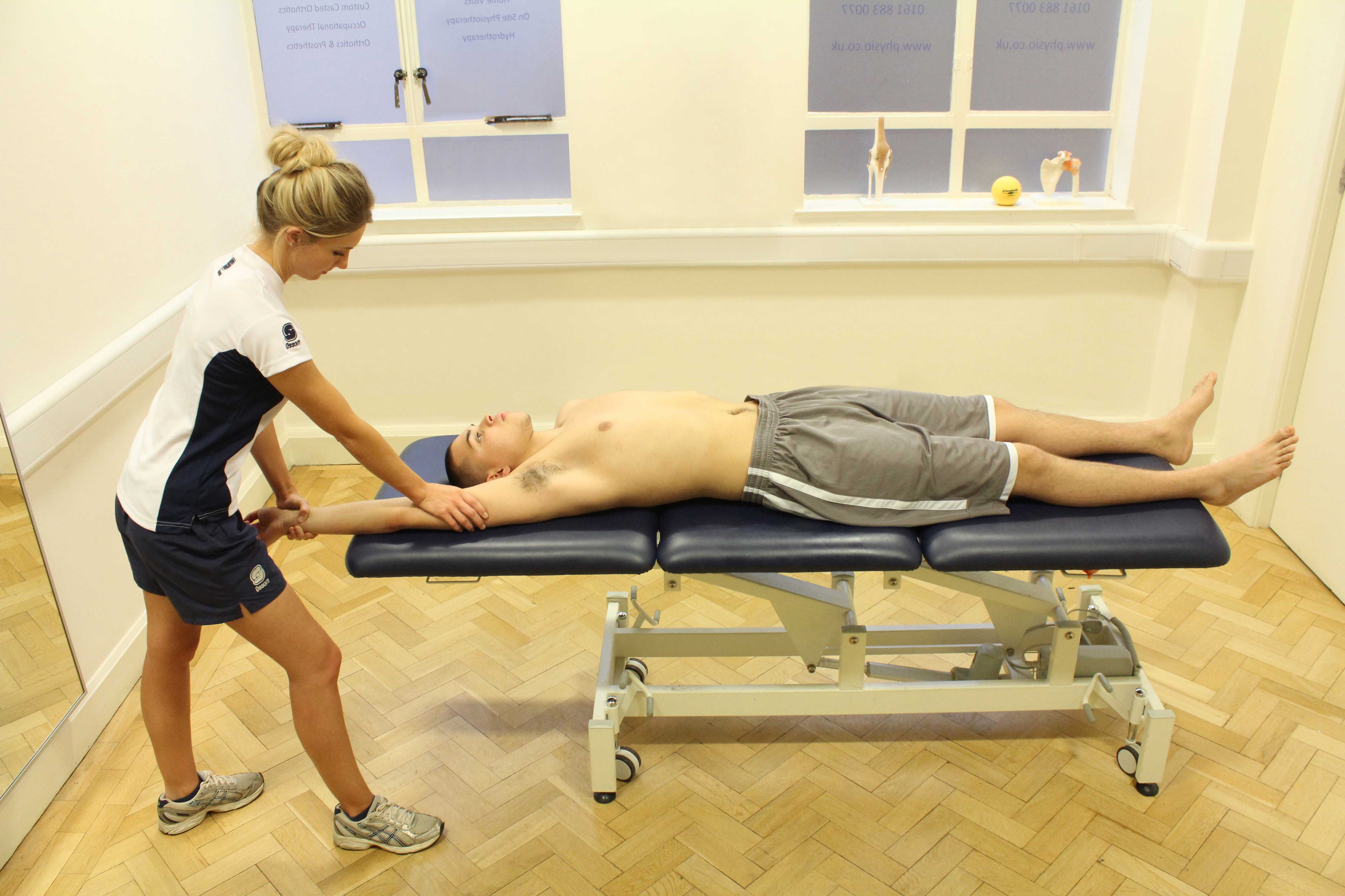 Soft tissue massage of the humerus and surrounding tissues. Soft tissue massage of the humerus and surrounding tissues.