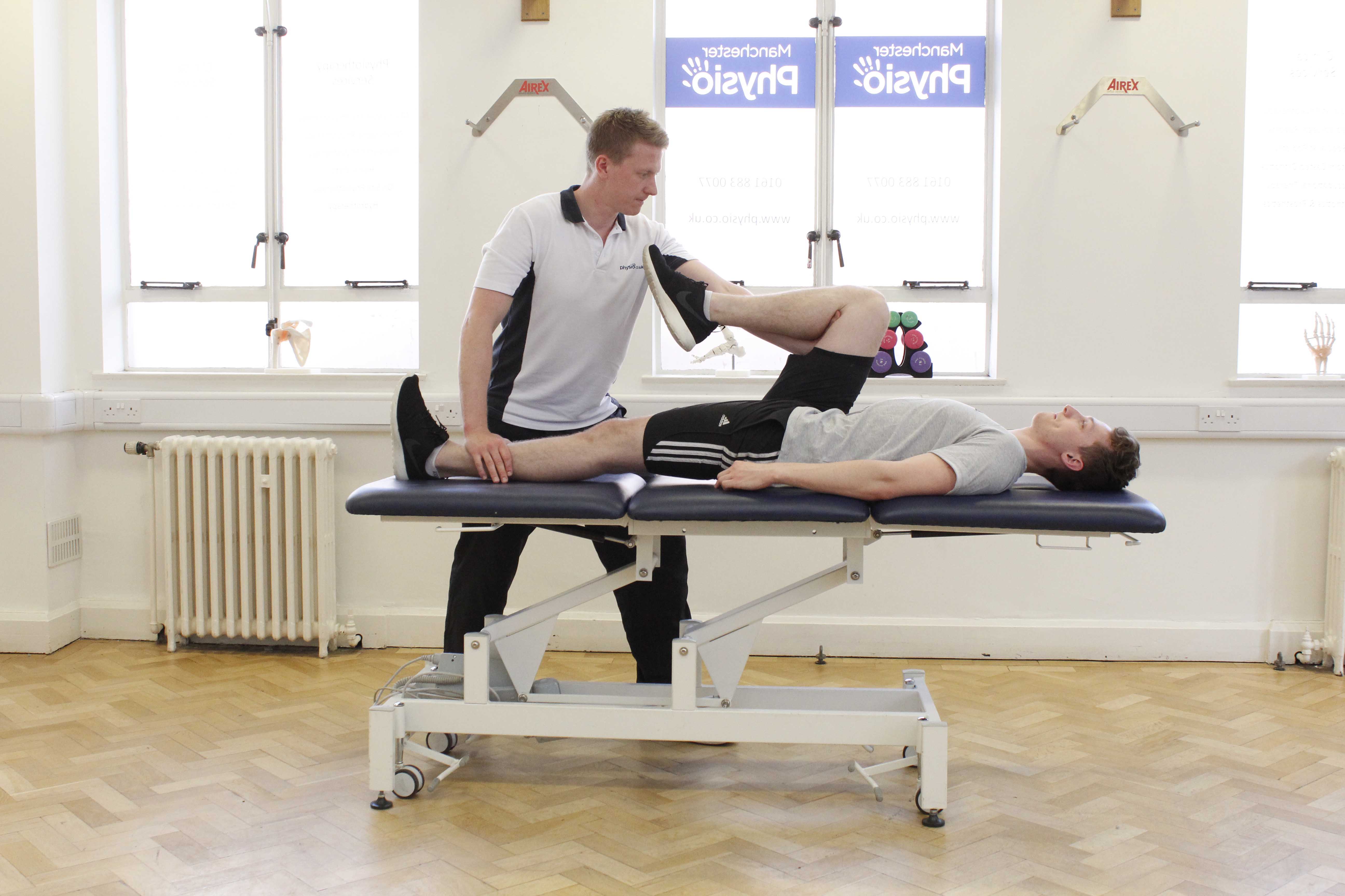 Passive stretch of the muscles and connective tissues of the hip and groin by specialist therapist