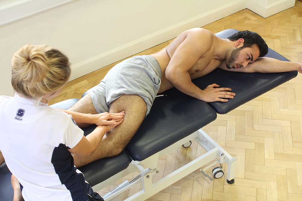 Soft tissue massage of vastus lateralis and illio-tibial band