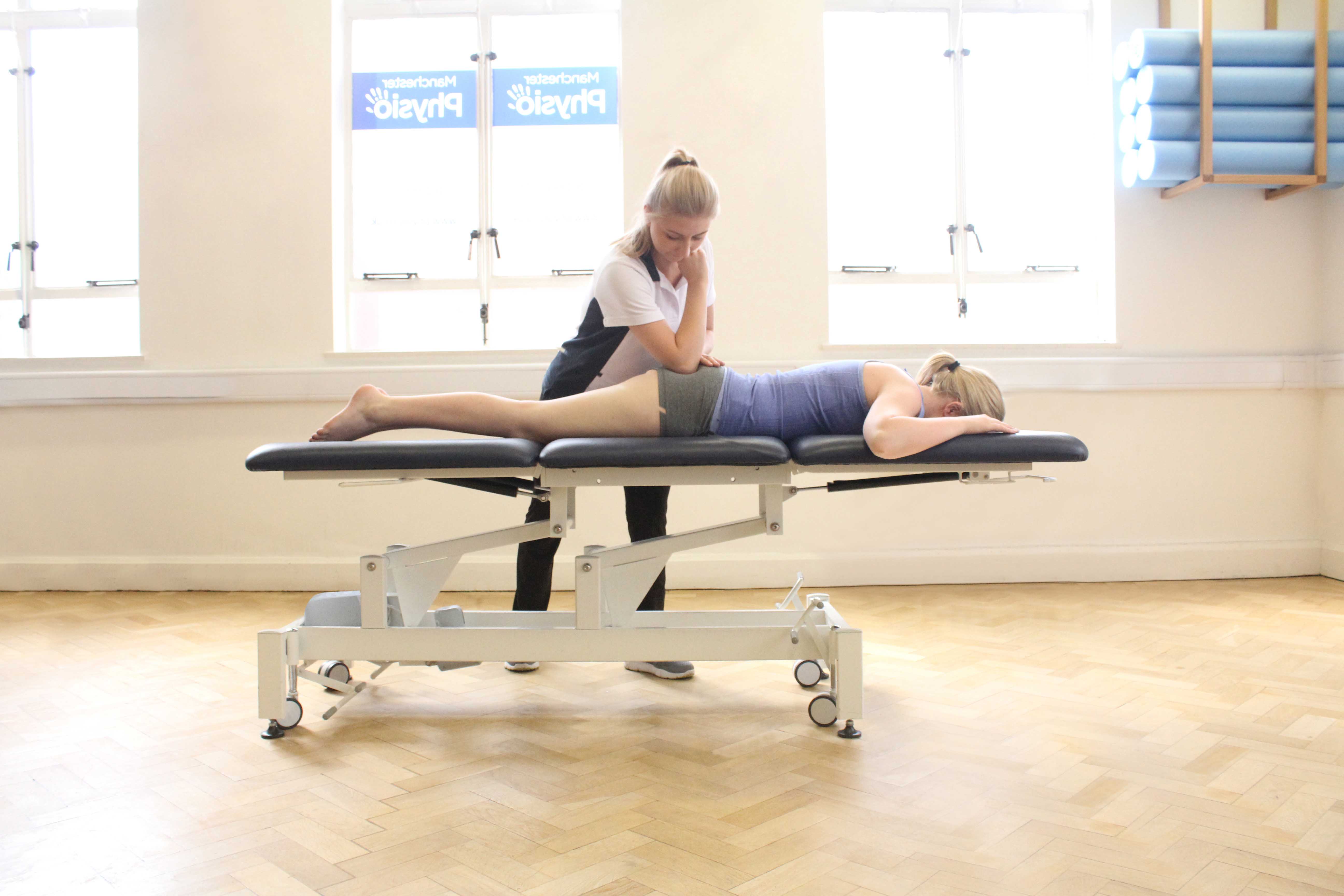 Deep tissue massage of the gluteus maximus muscle by specialist therapist