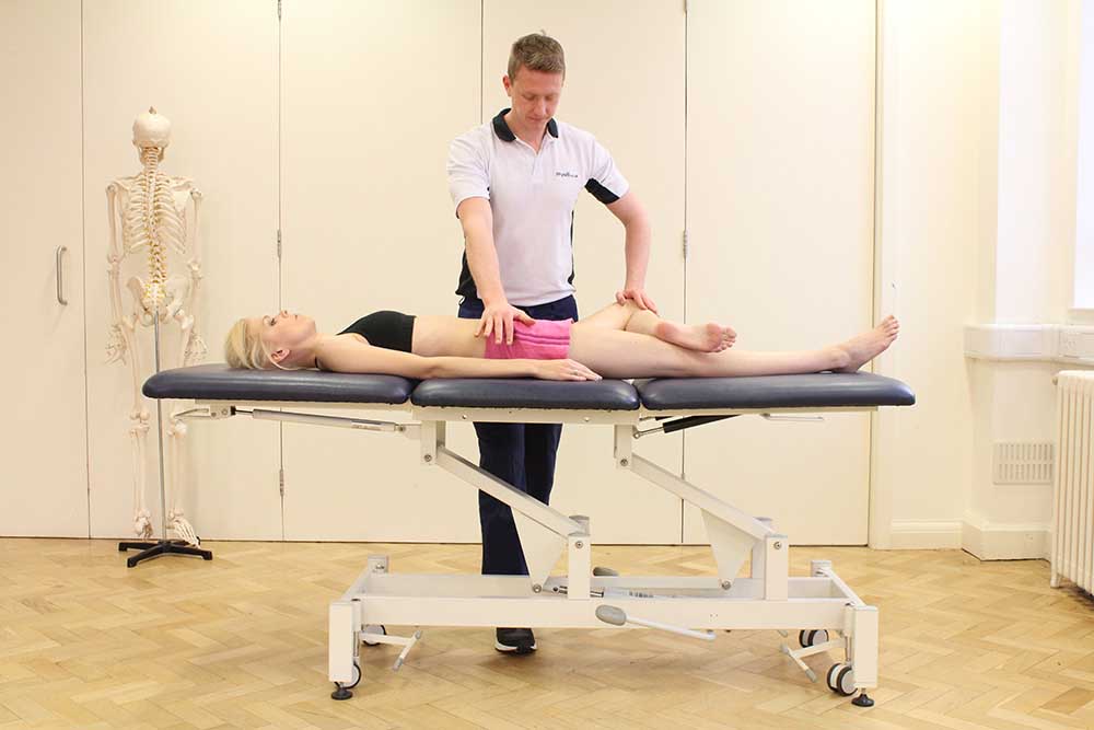 Passive stretches of the hip and pelvis performed by a senior musculoskeletal physiotherapsit Passive stretches of the hip and pelvis performed by a senior musculoskeletal physiotherapsit