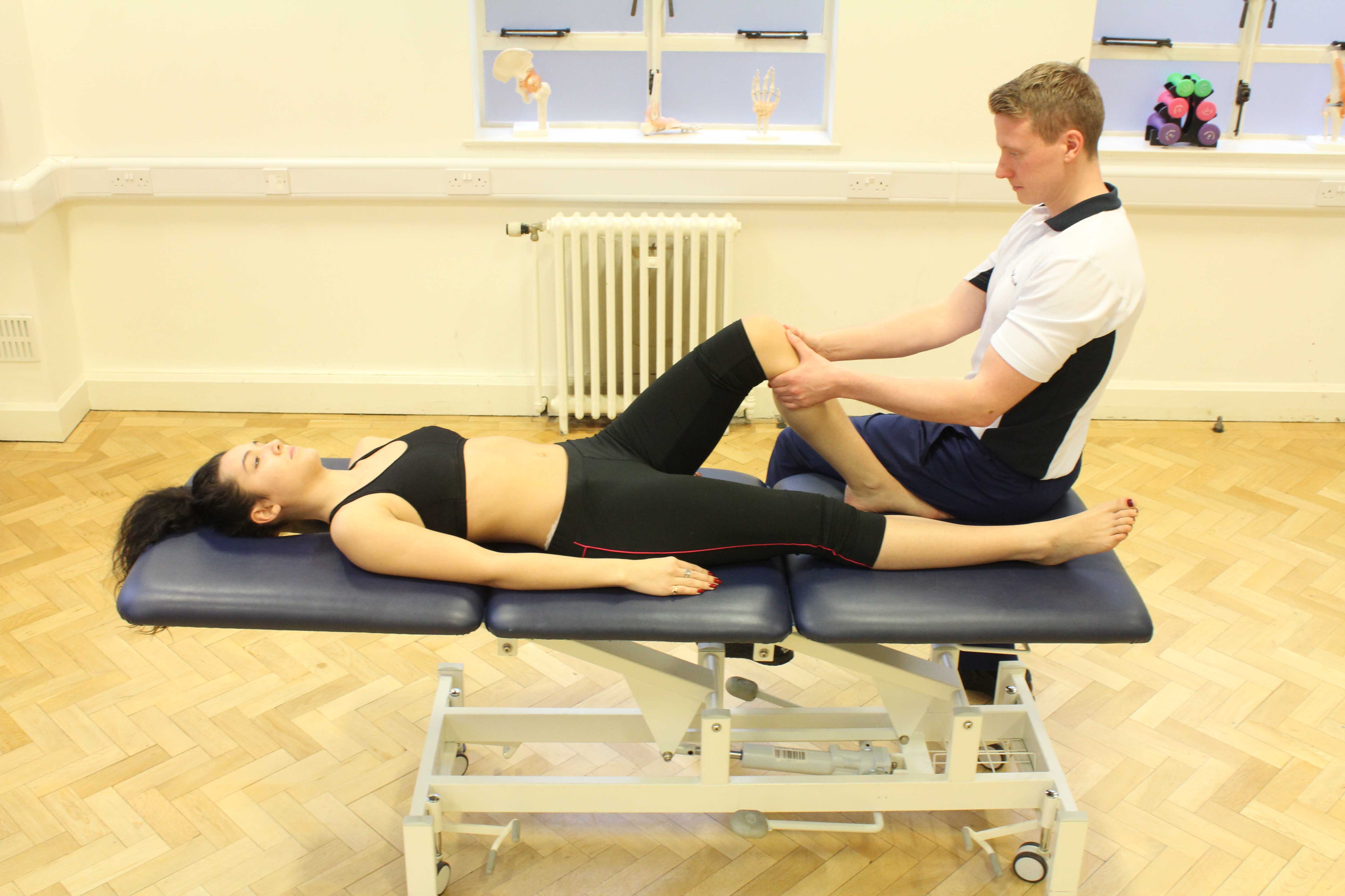 Our physiotherpaist assesing the knee for signs of mcl injury Our physiotherpaist assesing the knee for signs of mcl injury