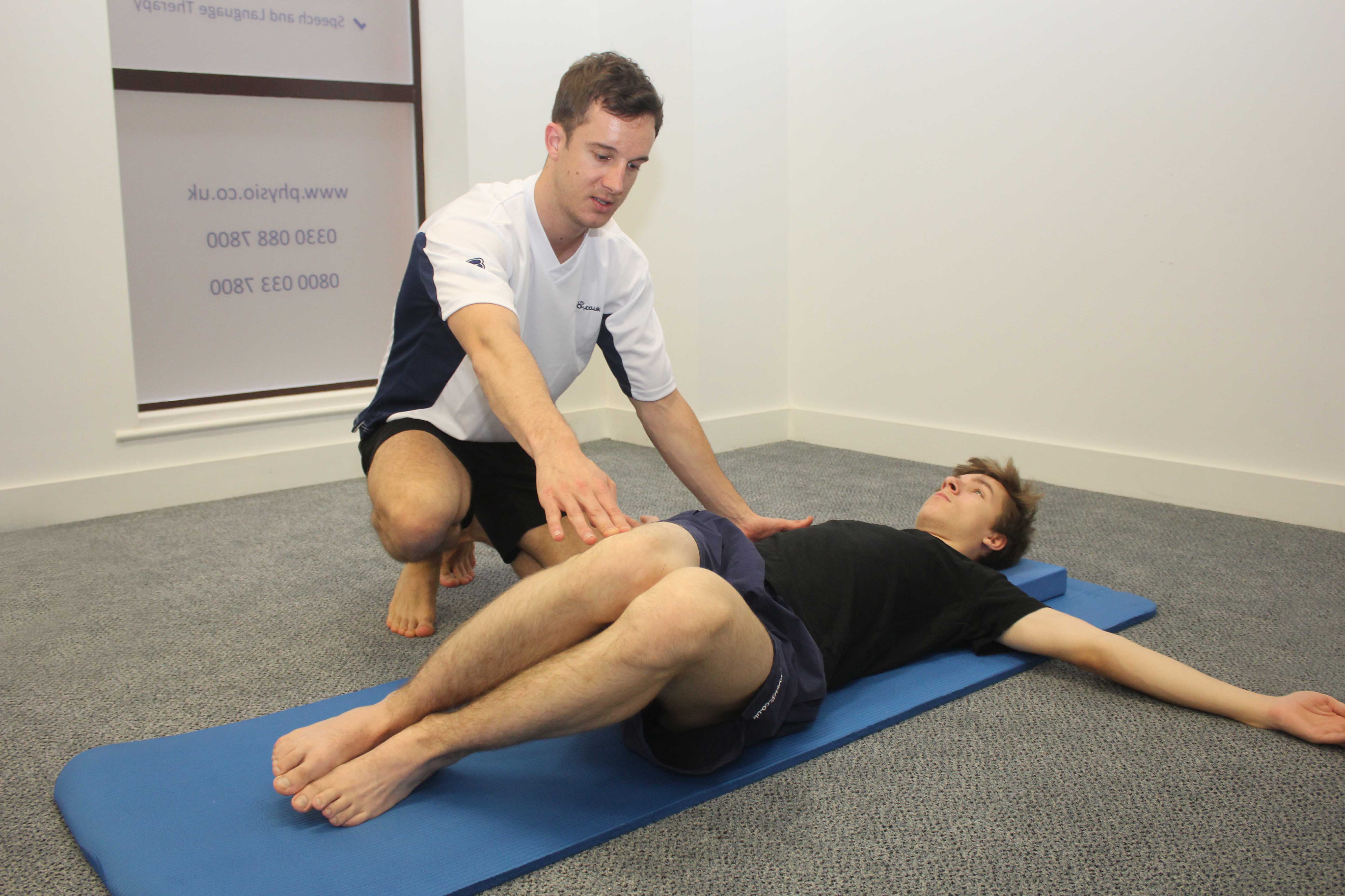Our physiotherpaist teaching a number of effective back stretches.