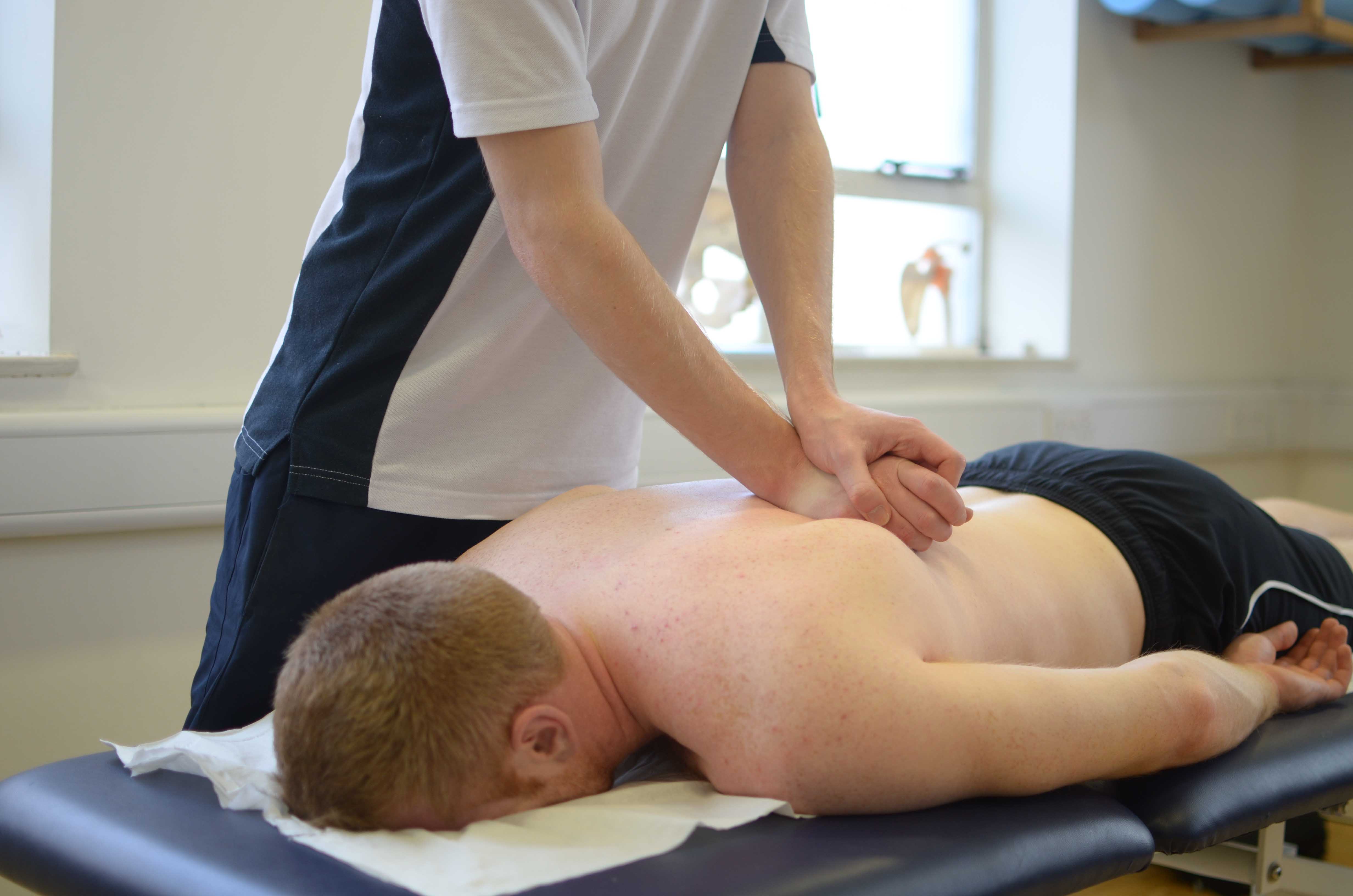 One of our physiotherapist performing manual therapy techniques to help ease muscle strain.