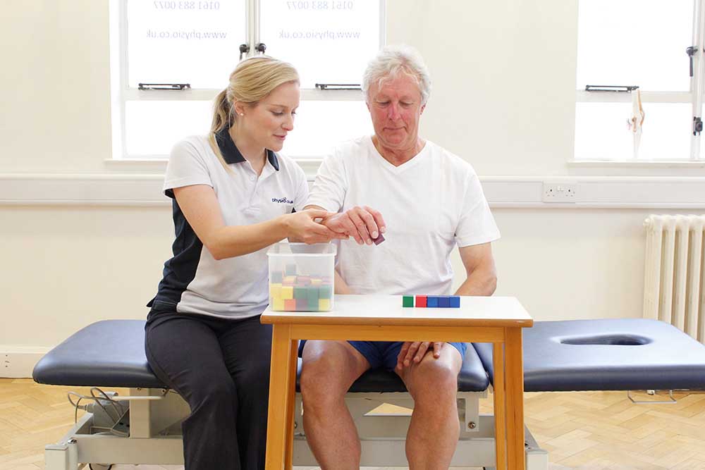 Fine motor skill exercises supervised by a specilaist neurological physiotherapist