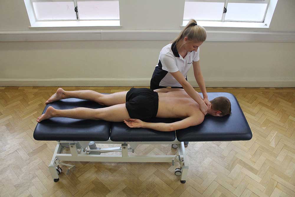 Soft Tissue Massage targeting trapezius muscle