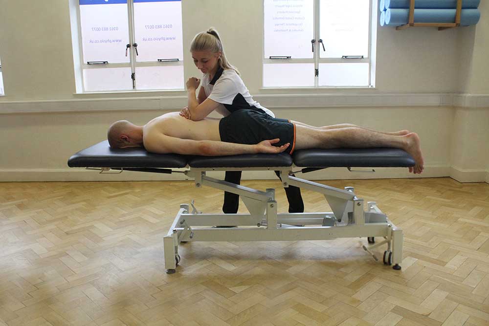 Soft Tissue Massage targeting latissimus dorsi muscle