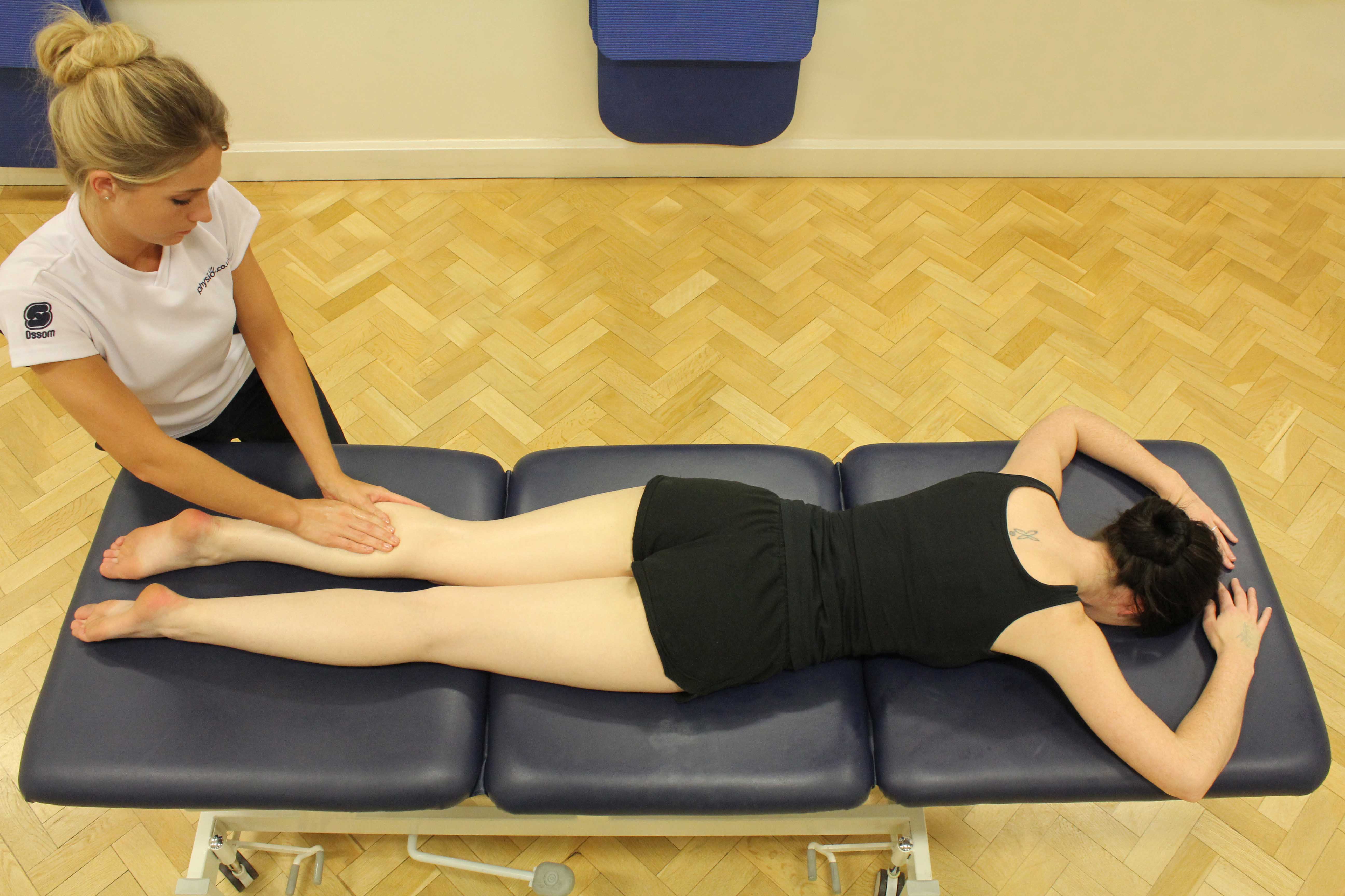 Soft tissue massage of the gastrocnemius muscle by an experienced therapist Soft tissue massage of the gastrocnemius muscle by an experienced therapist