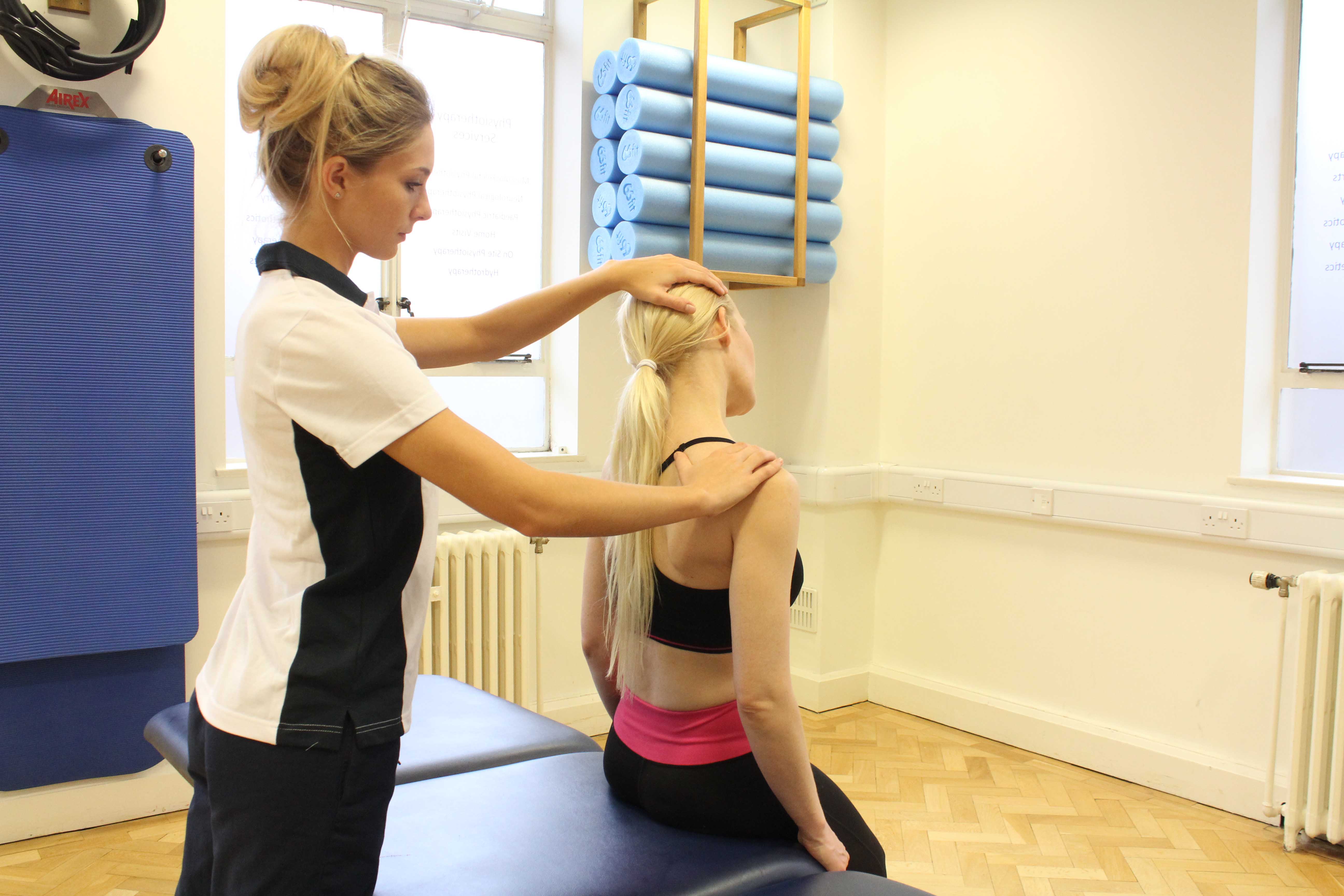 A passive stretch to help a patient with a stiff neck.