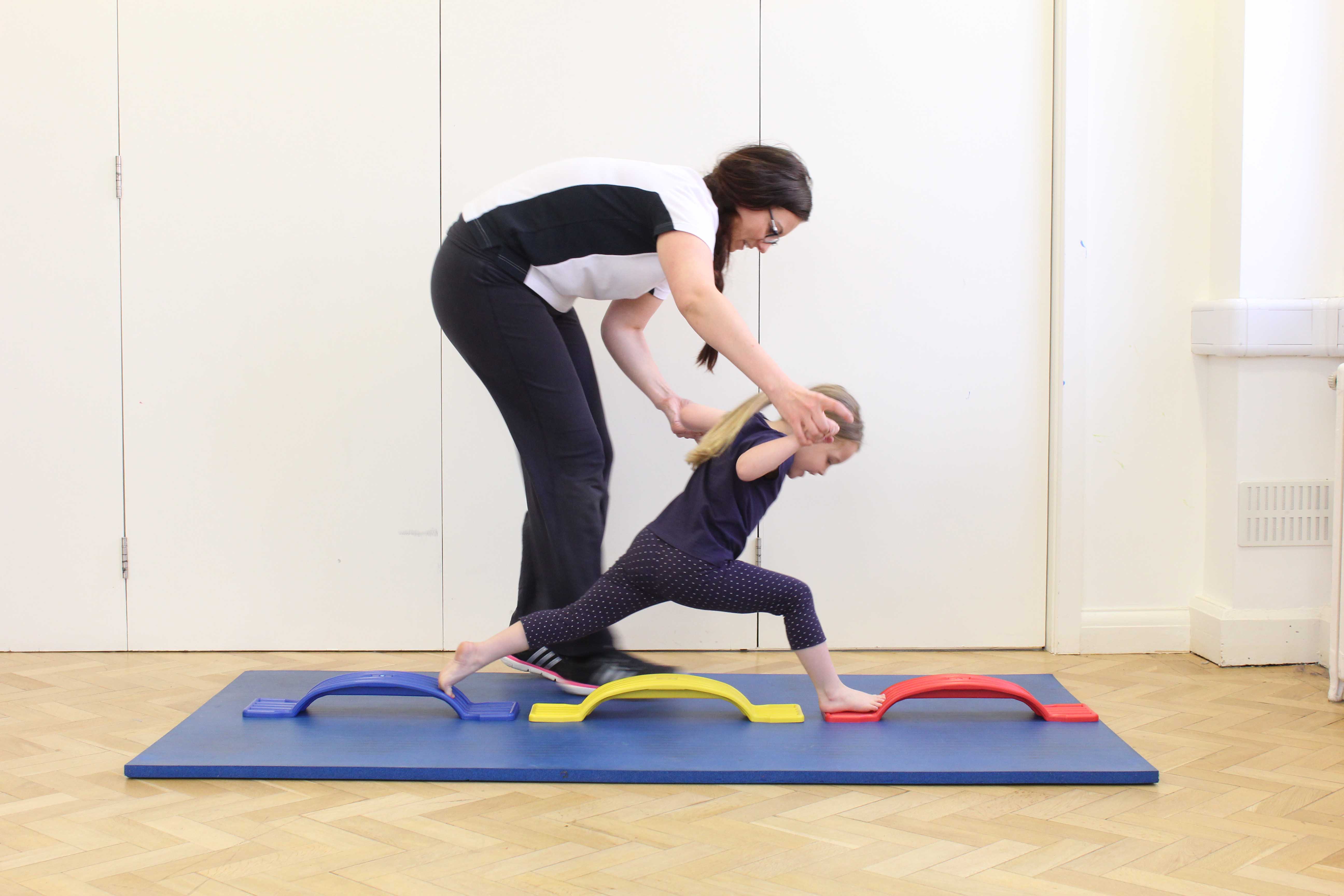 Functional rehabilitation exercises through play supervised by a specilaist paediatric physiotherapist