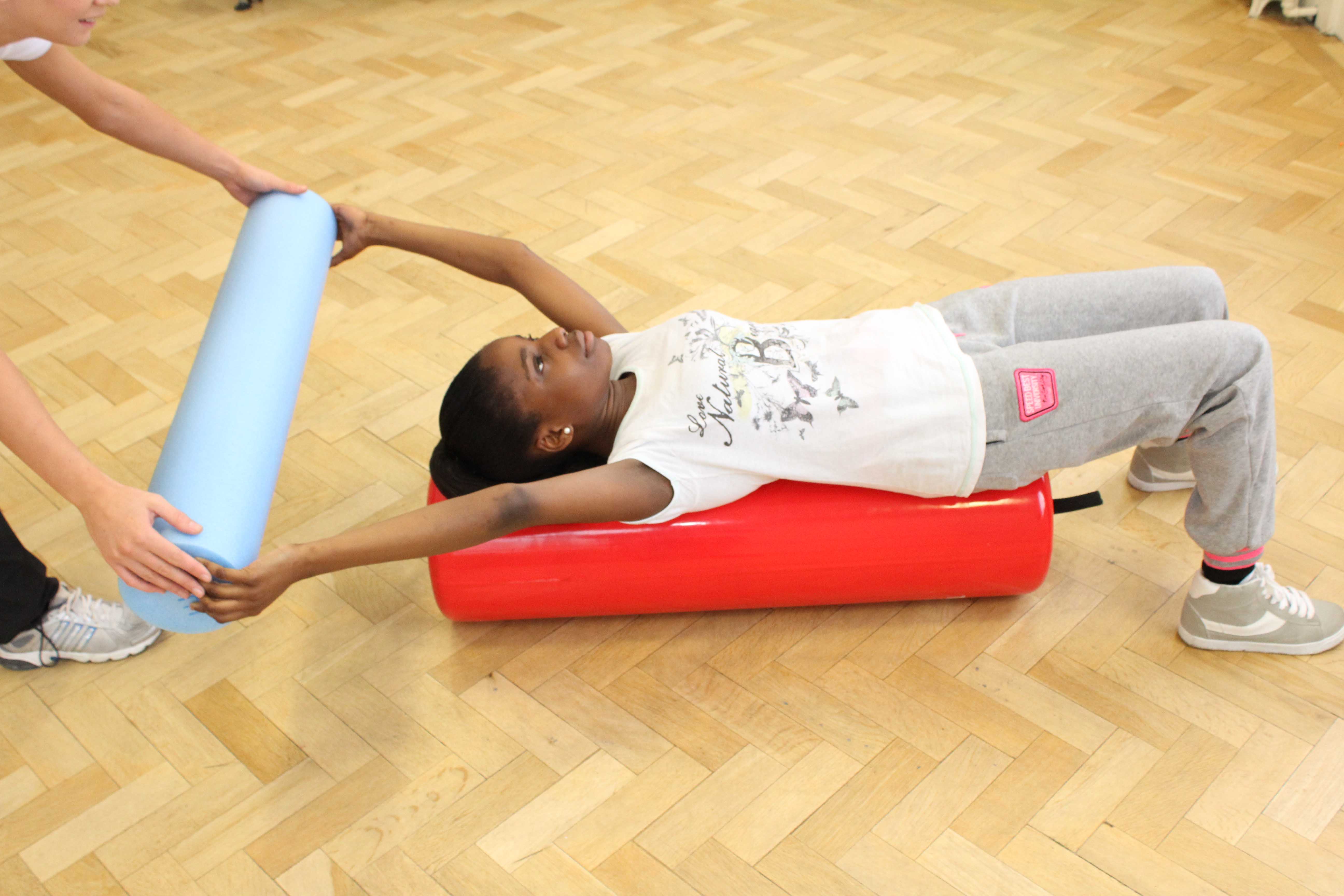Mobility, balance and stretching exercises assisted by paediatric physiotherapist