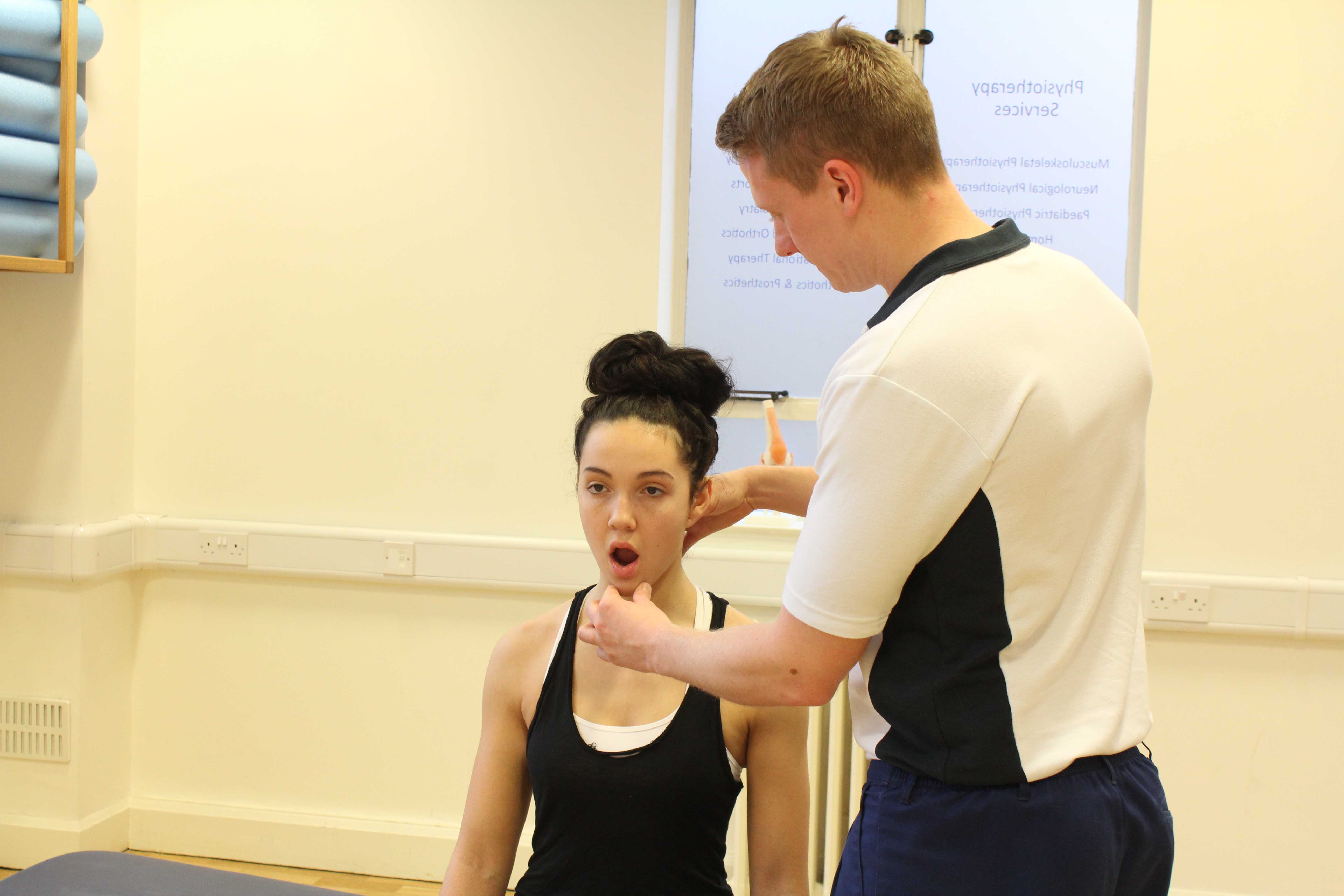 Massage and realignment of the temporomandibular joint by experienced physiotherapist Massage and realignment of the temporomandibular joint by experienced physiotherapist