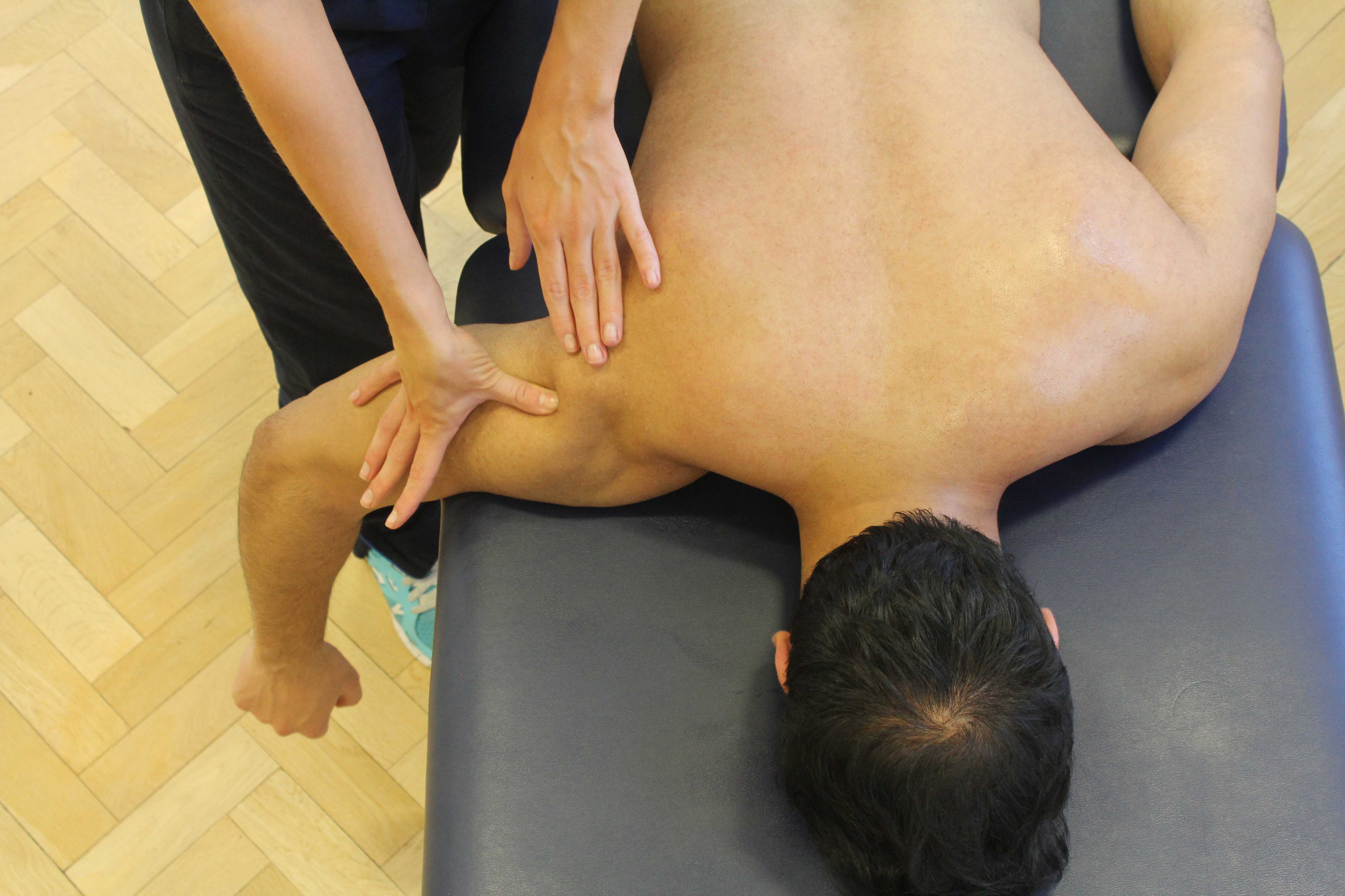 Soft tissue massage of triceps and upper arm