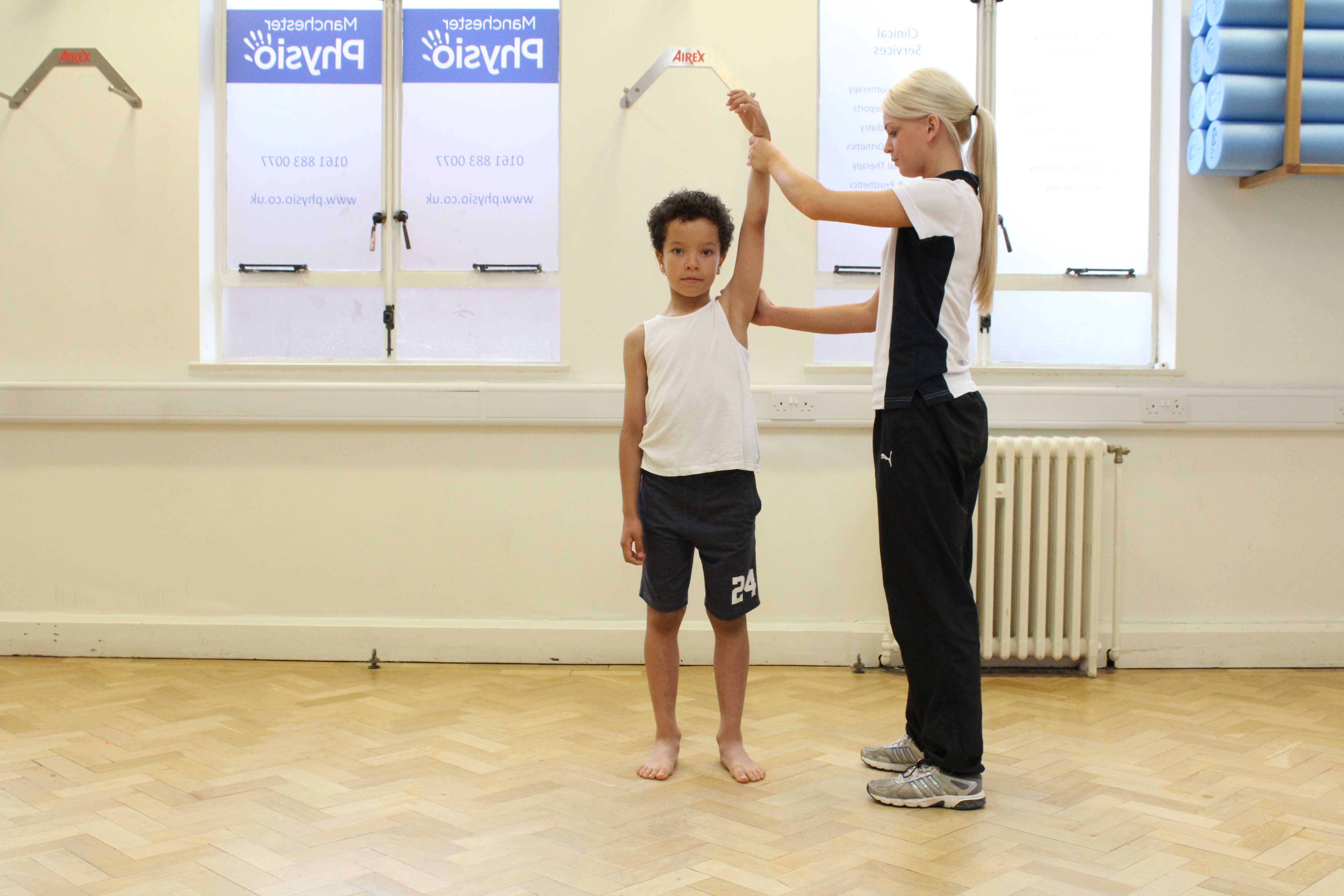 One of our younger clients undertaking a shoulder assesment with one of our physiotherapists.