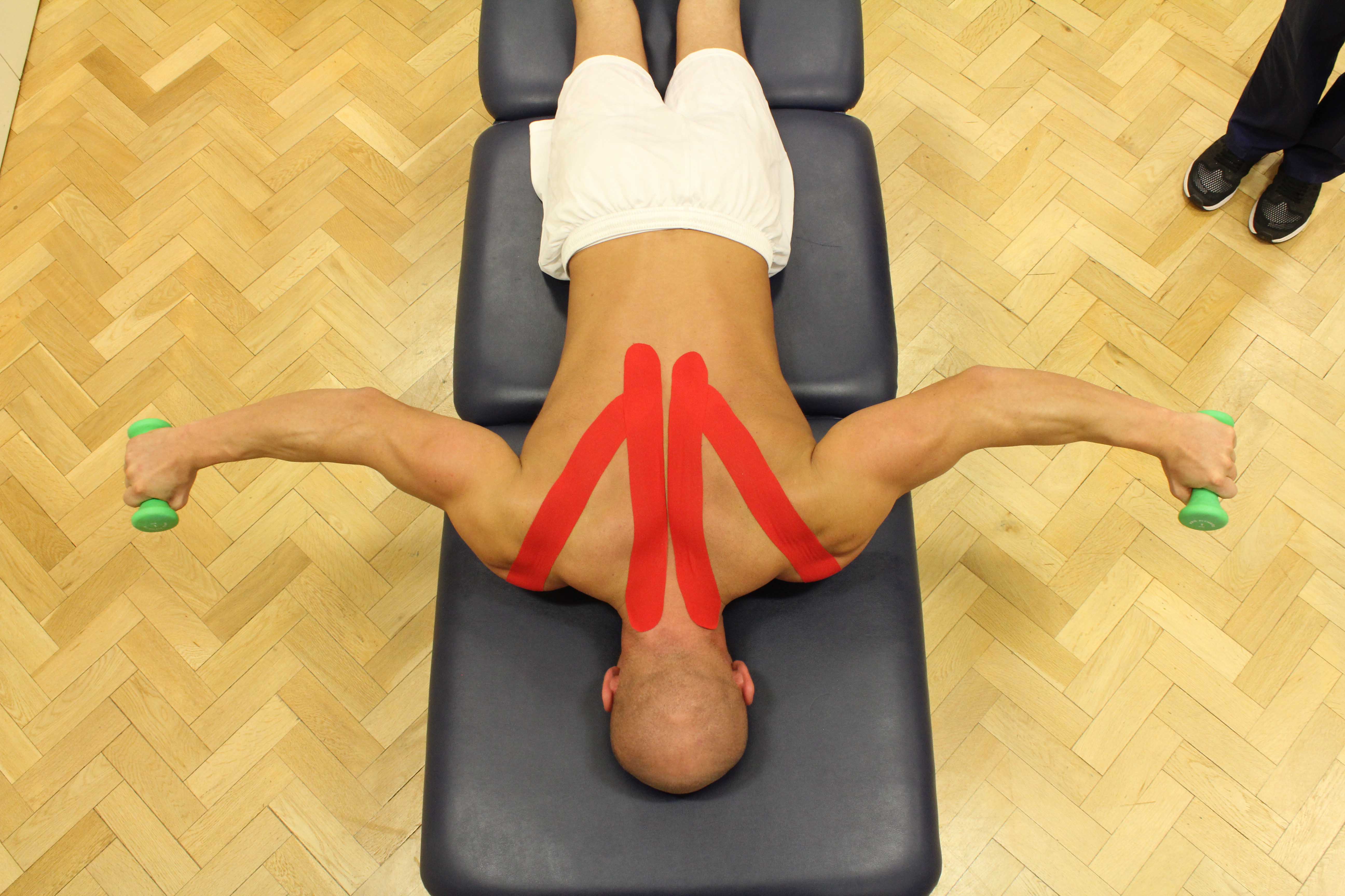 Percussion massage applied to the mid thoracic spine